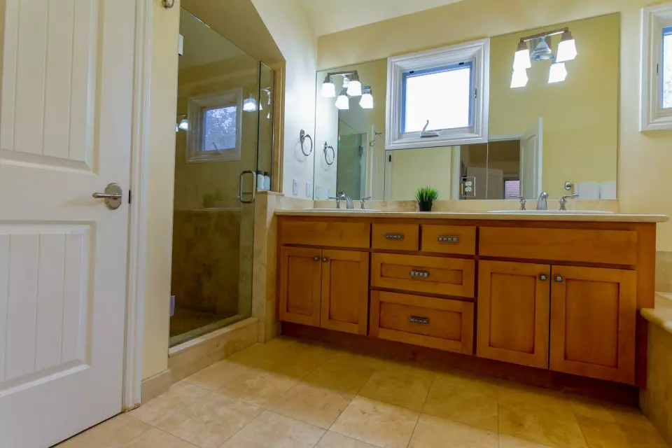 A bathroom with multiple fixtures for hygiene purposes.