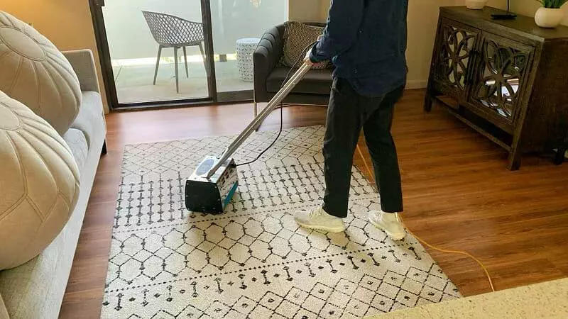 man, vacuuming