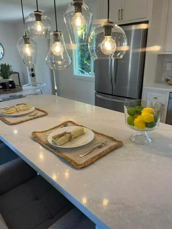 kitchen, white counter tops, glass pendant lights