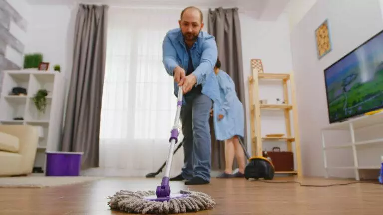Man, woman, cleaning floor