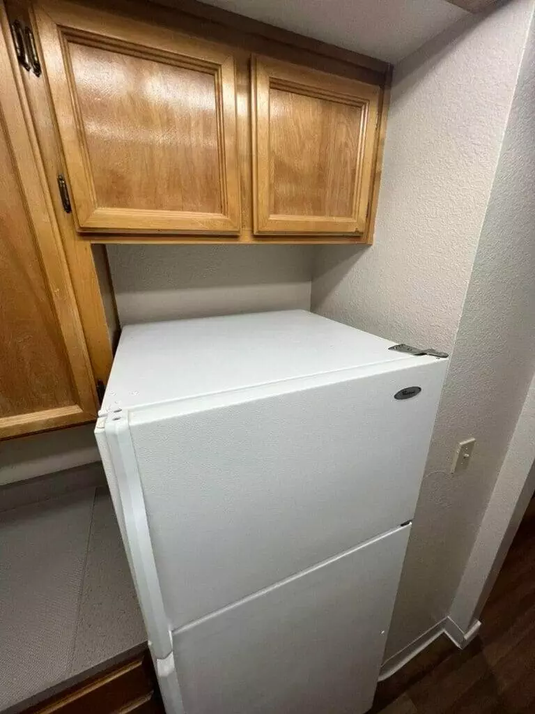 white refrigerator, kitchen, wood cabinets